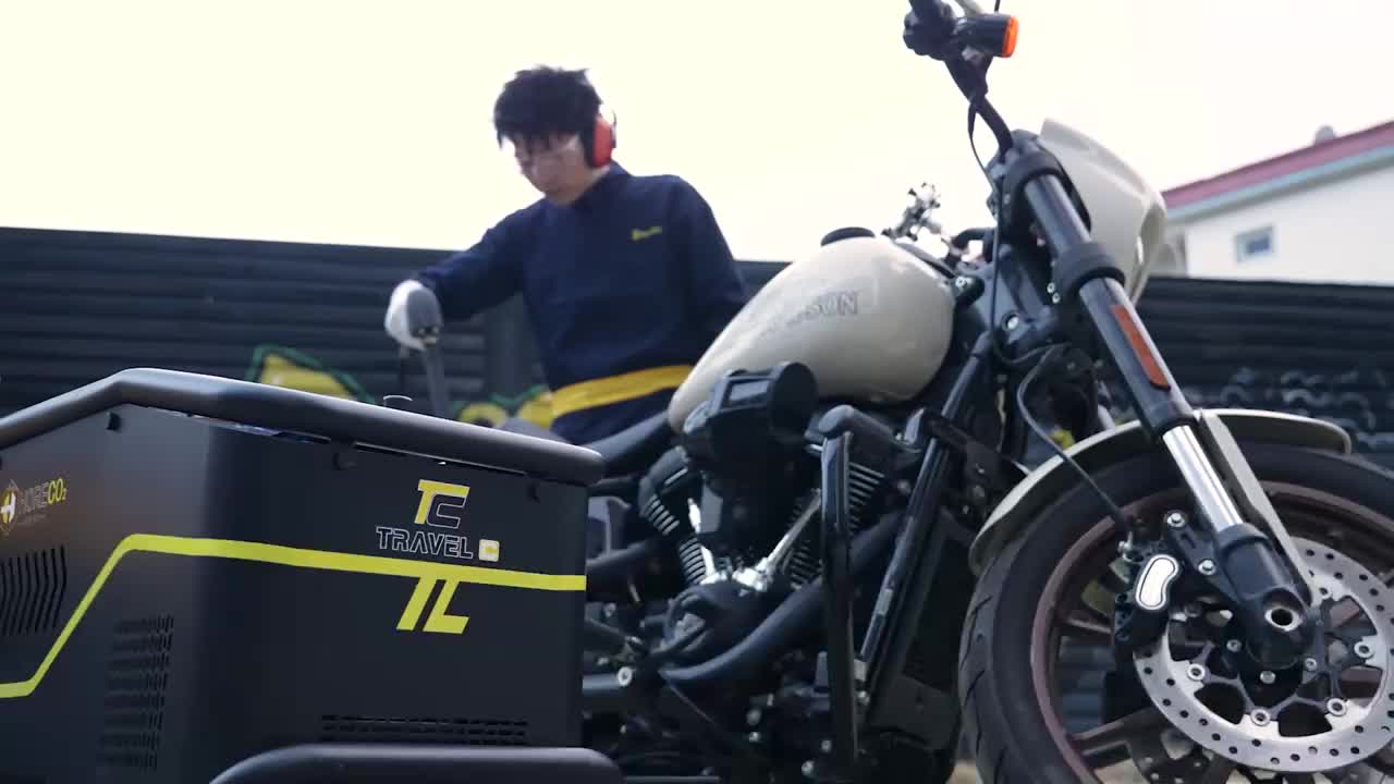 Dry ice blasting cleaning a Harley-Davidson motorcycle