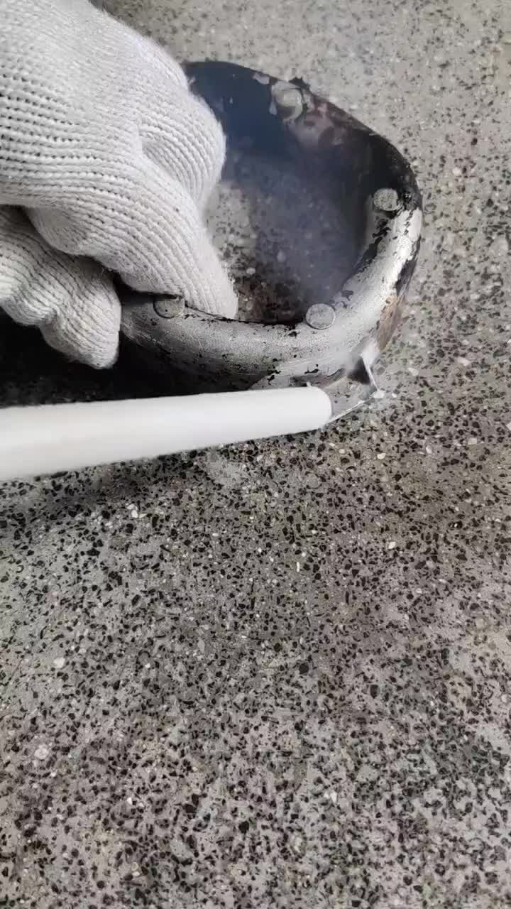 Dry ice blasting removing heavy carbon deposits from a small component
